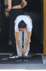 CARA SANTANA Stretches Out Before Hetting Her Workout Done in Los Angeles 08/12/2022