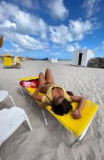 CLAUDIA ROMANI in Bikini at a Beach in Miami 08/11/2022