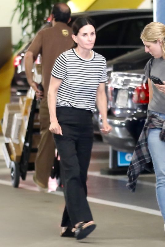 COURTENEY COX and Her Assistant Arrives at a Business Office in Beverly Hills 08/08/2022