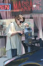 ELIZABETH OLSEN Shopping at Erewhon Market in Studio City 08/12/2022