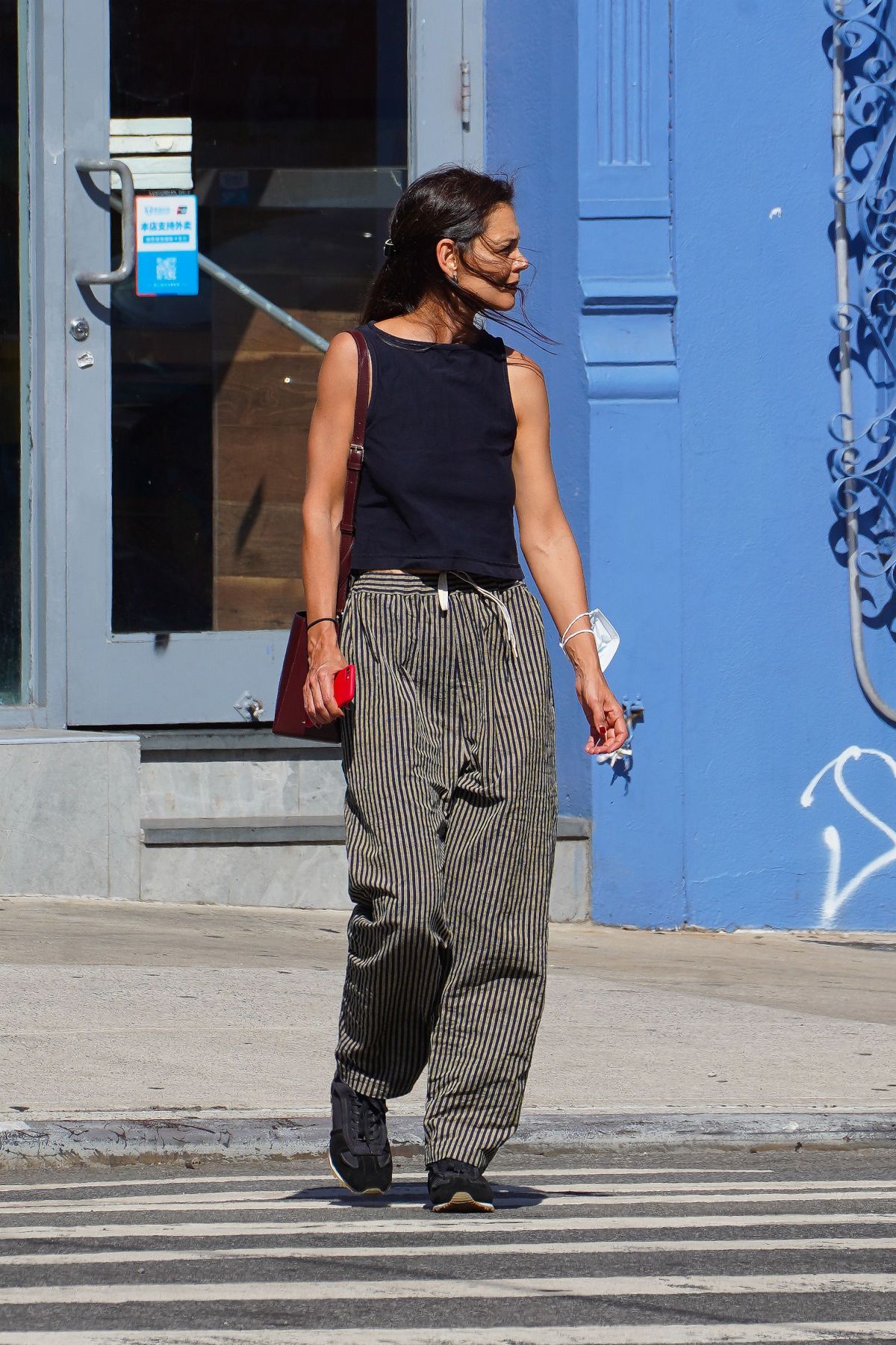 KATIE HOLMES Out Chatting on Her Phone in New York 08/30/2022.