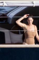 KATY PERRY in a Brown Strapless Swimsuit at a Yacht in Nerano 08/24/2022