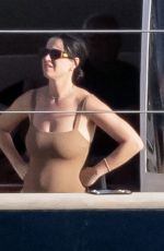 KATY PERRY in a Brown Strapless Swimsuit at a Yacht in Nerano 08/24/2022