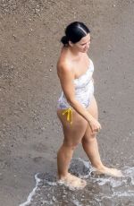 KATY PERRY in Swimsuit at a Beach in Positano 08/26/2022