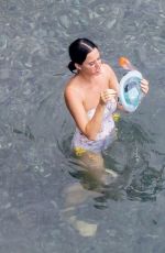 KATY PERRY in Swimsuit at a Beach in Positano 08/26/2022