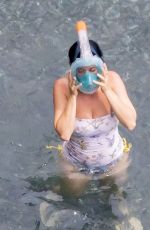 KATY PERRY in Swimsuit at a Beach in Positano 08/26/2022