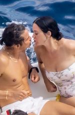 KATY PERRY in Swimsuit at a Beach in Positano 08/26/2022