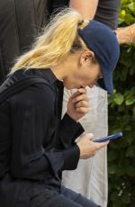 LILY JAMES Arrives at Heathrow Airport in London 08/03/2022