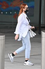 LINDSAY LOHAN Arrives at JFK Airport in New York 07/29/2022