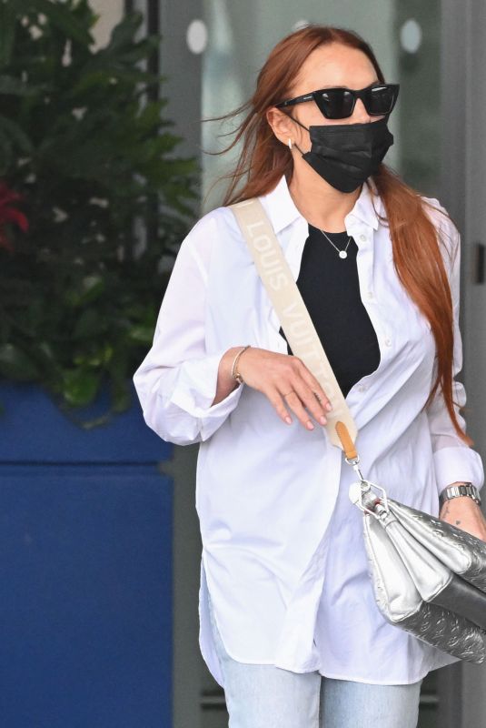 LINDSAY LOHAN Arrives at JFK Airport in New York 07/29/2022