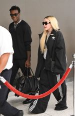 MADONNA Arrives with Her Son David Banda at JFK Airport in New York 08/11/2022