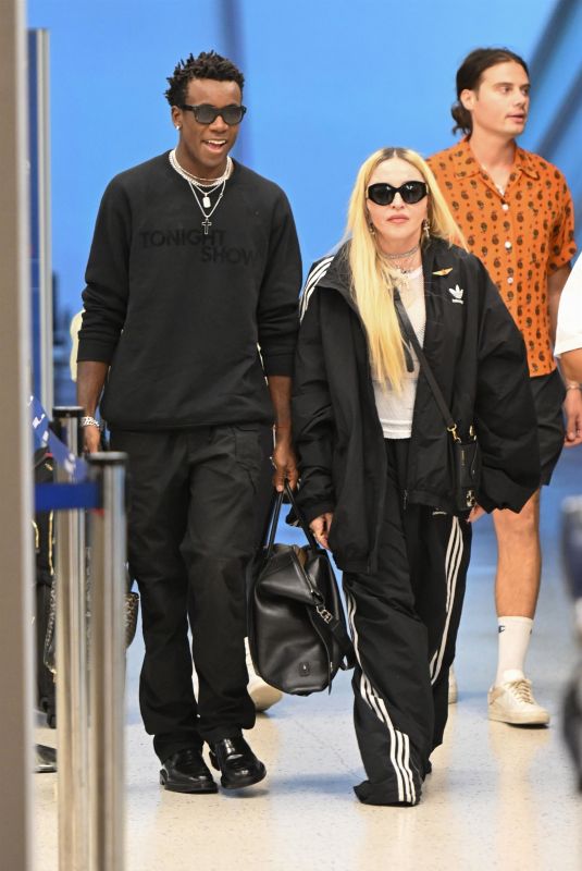 MADONNA Arrives with Her Son David Banda at JFK Airport in New York 08/11/2022