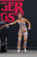 MILLIE BOBBY BROWN and Jake Bongiovi Arrives at Stranger Things Experience in New York 08/10/2022