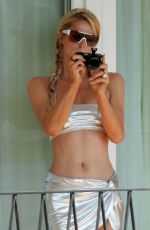 PARIS HILTON in a Silver Bikini on Hotel Room