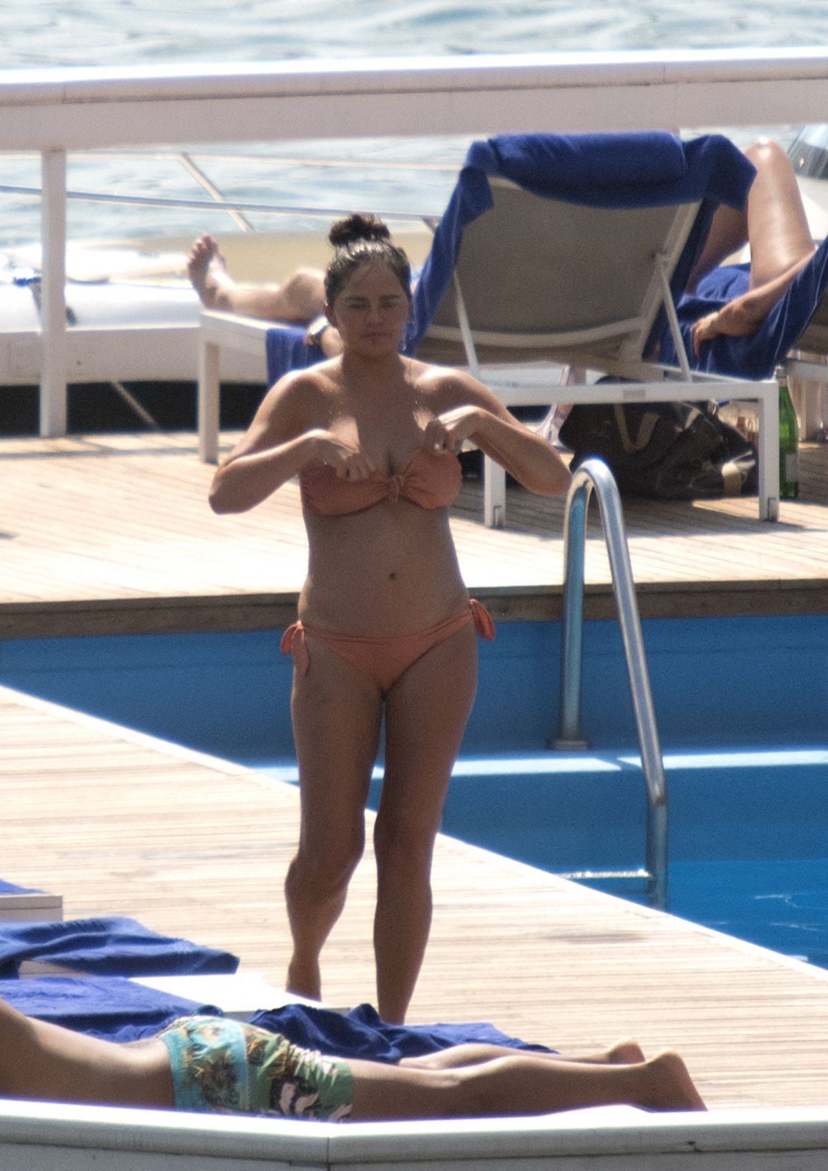 Pregnant CHRISSY TEIGEN in Bikini at a Pool at Lake Como 08/28/2022.