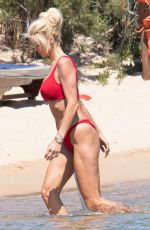 VICTORIA SILVSTEDT in a Red Bikini at a Beach in Porto Cervo 08/04/2022