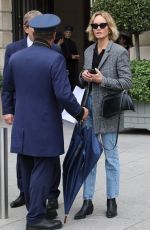 AMBER VALLETTA Catches a Cab Outside a Hotel in Paris 09/29/2022