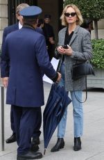 AMBER VALLETTA Catches a Cab Outside a Hotel in Paris 09/29/2022