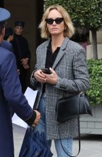 AMBER VALLETTA Catches a Cab Outside a Hotel in Paris 09/29/2022