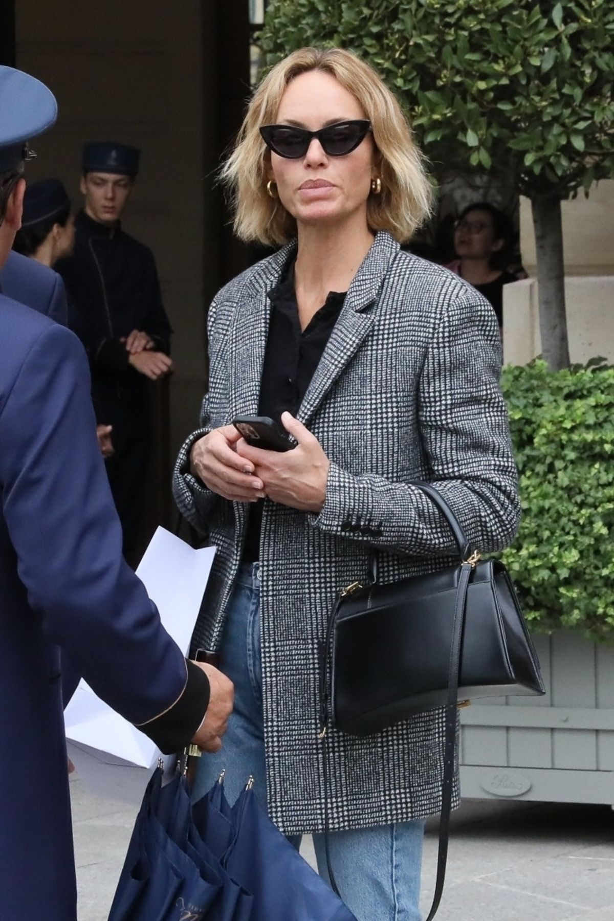 AMBER VALLETTA Catches a Cab Outside a Hotel in Paris 09/29/2022 ...