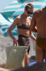 CANDICE SWANEPOEL in Bikini Top at a Beach in Miami 09/17/2022