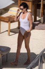 CHARLIZE THERON in a White Swimsuit on Holiday in Tuscany 09/05/2022