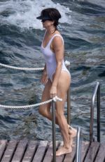 CHARLIZE THERON in a White Swimsuit on Holiday in Tuscany 09/05/2022