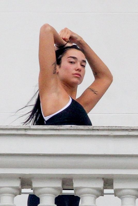 DUA LIPA Gets a Yoga Class on Balcony of Copacabana Palace Hotel in Rio de Janeiro 09/11/2022