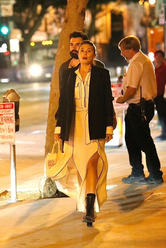 ELIZABETH OLSEN at Banksy’s Celebration of Girl on a Swing in Los Angeles 09/22/2022