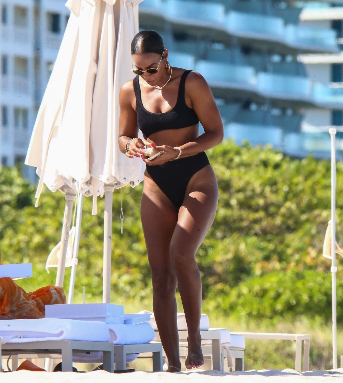 KELLY ROWLAND in Bikini at a Beach in Miami 09/01/2022. 