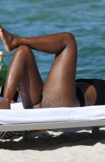 KELLY ROWLAND in Bikini at a Beach in Miami 09/01/2022