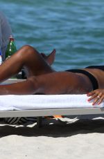 KELLY ROWLAND in Bikini at a Beach in Miami 09/01/2022
