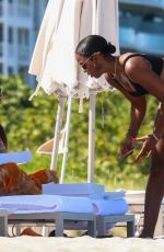 KELLY ROWLAND in Bikini at a Beach in Miami 09/01/2022