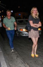 KIRSTEN DUNST Arrives at Aaron Paul