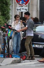 LILY COLLINS and Charlie McDowell Out for a Scooter Ride in Paris 09/15/2022