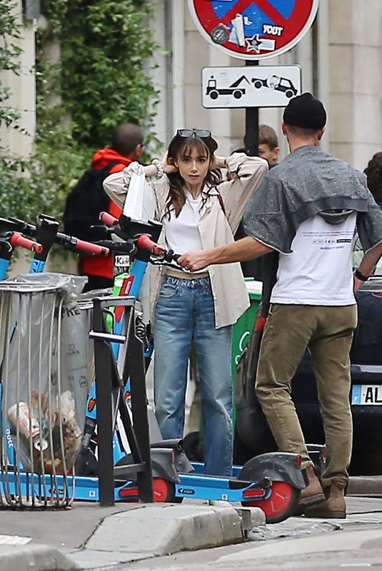 LILY COLLINS and Charlie McDowell Out for a Scooter Ride in Paris 09/15/2022