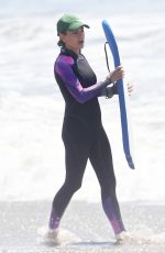 MILA KUNIS in Wetsuit at a Beach in Santa Barbara 09/04/2022