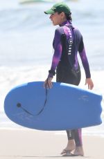 MILA KUNIS in Wetsuit at a Beach in Santa Barbara 09/04/2022