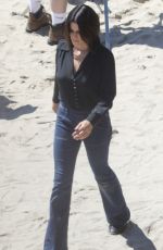 NEVE CAMPBELL Filming Scenes at a Beach in Malibu 09/20/2022