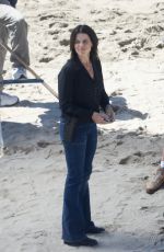 NEVE CAMPBELL Filming Scenes at a Beach in Malibu 09/20/2022