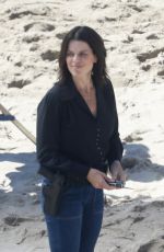 NEVE CAMPBELL Filming Scenes at a Beach in Malibu 09/20/2022