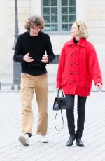 AMBER VALLETTA Out with Her Don Auden McCaw in Paris 10/01/2022