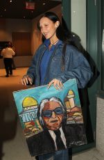 BELLA HADID Receives a Painting of Her Dad while Out in New York 10/10/2022
