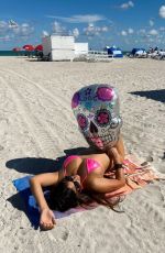 CLAUDIA ROMANI in Bikini Celebrates Halloween at Miami Beach 10/23/2022