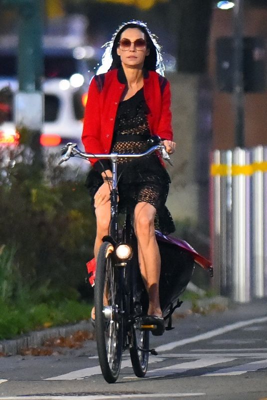 FAMKE JANSSEN Out Riding a Bike in New York 10/10/2022