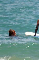 JENNIFER ANISTON in Bikini Takes Surf Lessons in Hawaii 08/23/2007