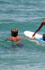 JENNIFER ANISTON in Bikini Takes Surf Lessons in Hawaii 08/23/2007