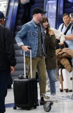 LILY COLLINS and Charlie McDowell at LAX Airport in Los Angeles 10/27/2022