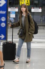 LILY COLLINS and Charlie McDowell at LAX Airport in Los Angeles 10/27/2022