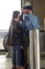 LILY COLLINS and Charlie McDowell at LAX Airport in Los Angeles 10/27/2022